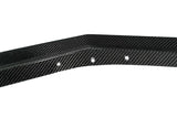 A close-up of a black carbon fiber trim piece with a glossy woven texture and three visible mounting holes, shown against a plain white background with a Paragon logo in the bottom right corner.