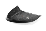 A curved carbon fiber automotive part with a visible woven carbon pattern, photographed on a clean white background. A small Paragon logo sticker is visible on the product, and a larger Paragon watermark is in the bottom right corner.